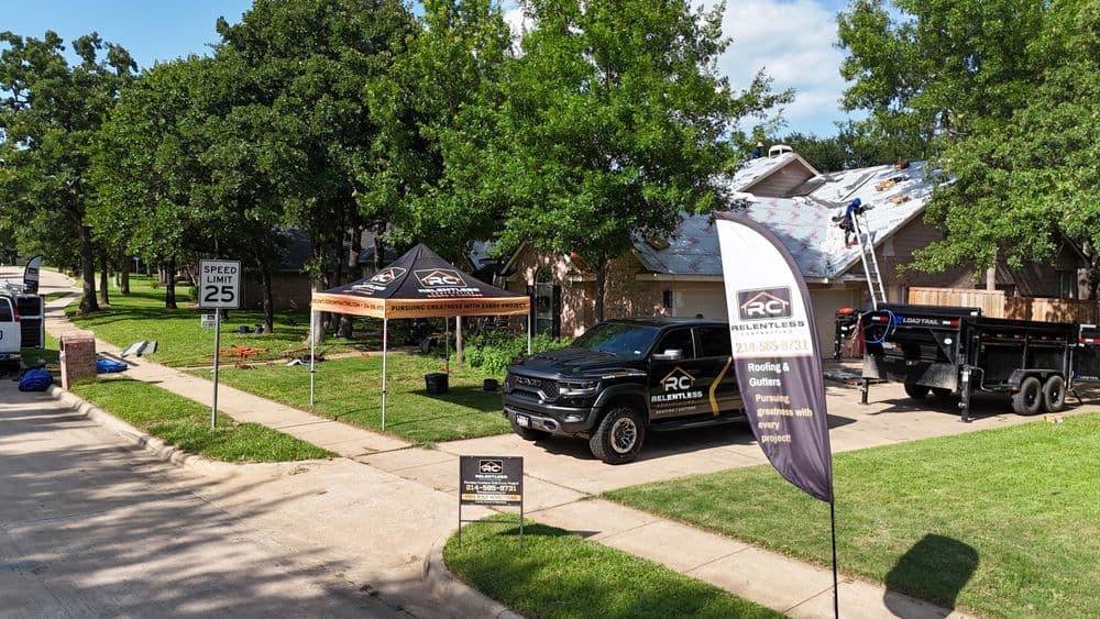 Renovation services setup with tents, trucks, and tools in a residential neighborhood.